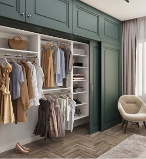 Open closet with green sliding doors reveals neatly organized clothes, baskets, and shelves—creating a space as thoughtfully arranged as a well-designed Mega Menu. A cream-colored chair sits nearby, and sunlight streams in through a window with sheer curtains for an inviting atmosphere reminiscent of premium services.