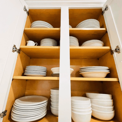 organized dishes in kitchen cabinet by Organized Jill