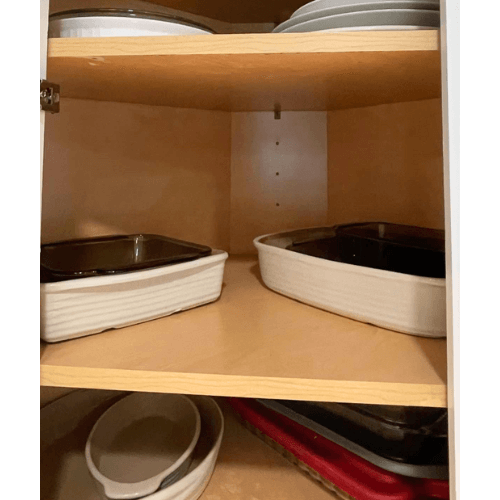 organized cookware in kitchen cabinet by Organized Jill