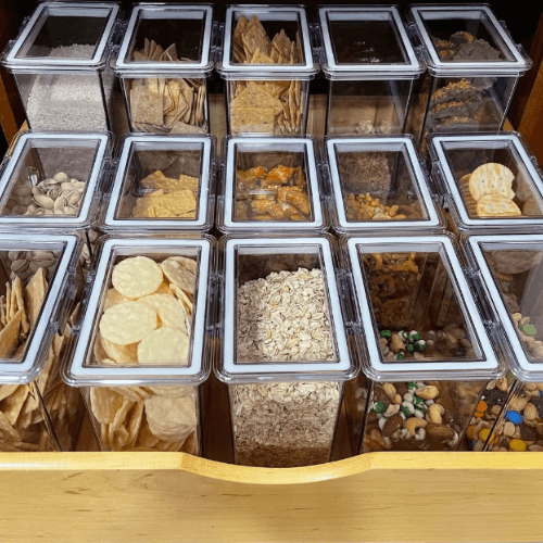 decanted pantry items organized in clear containers by Organized Jill