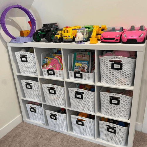 organized kids toy shelf with labeled baskets by Organized Jill
