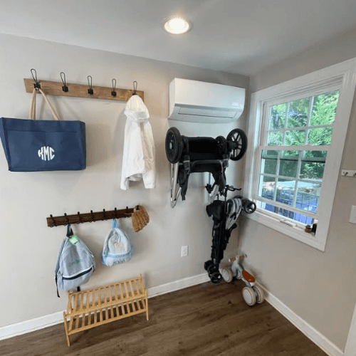 organized entryway with hooks for daily items and shelf by Organized Jill