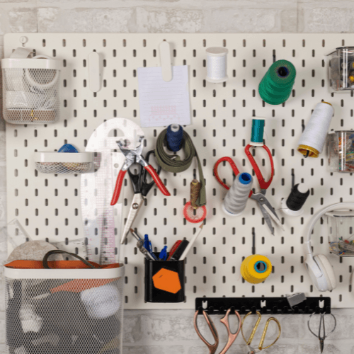 organized craft supplies on pegboard